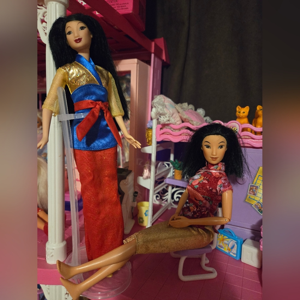 Two Mulan Dolls different years
